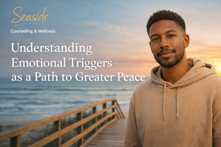 Young African American man standing on a beach at sunset representing emotional awareness and healing through understanding emotional triggers
